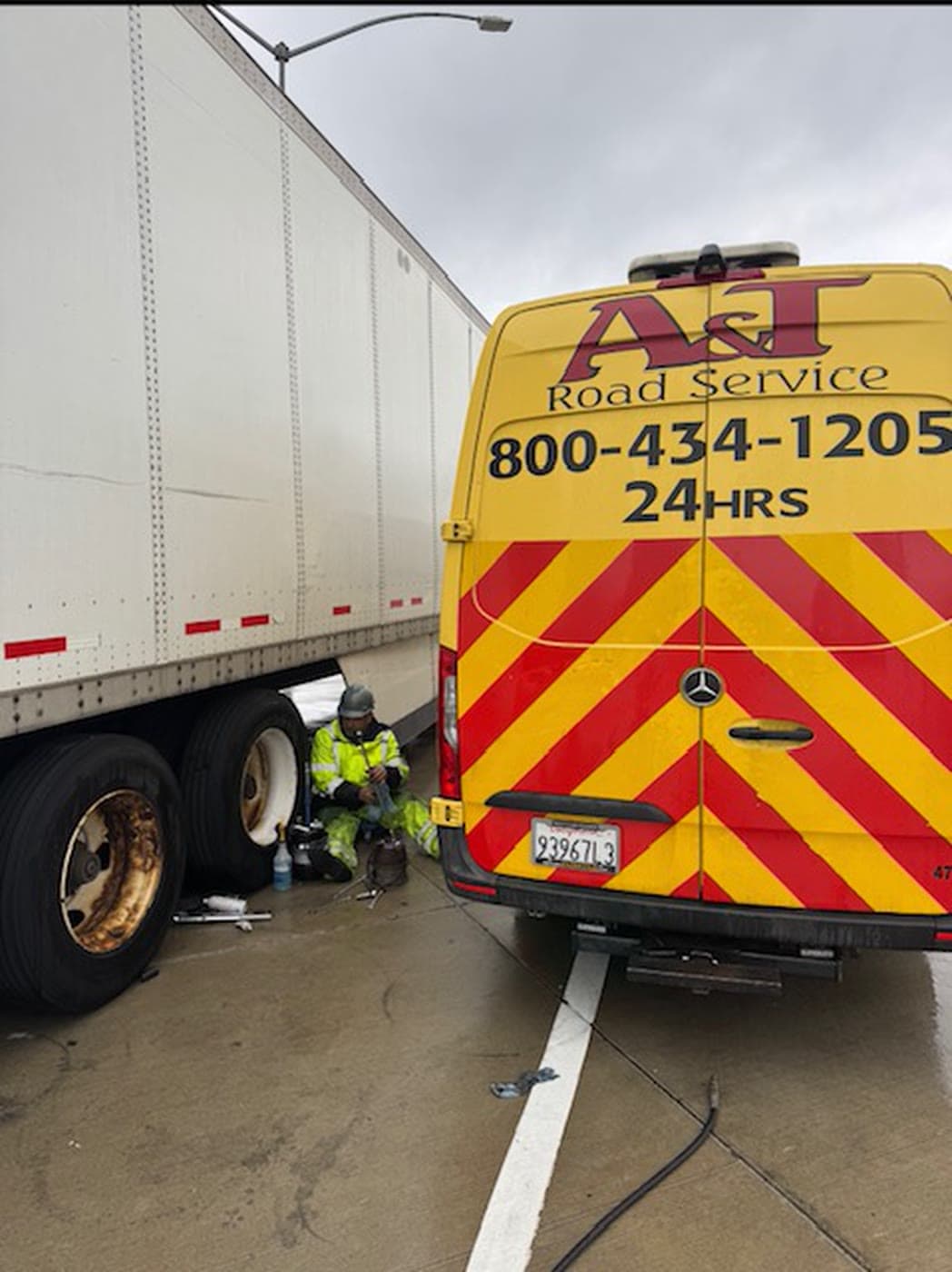 A&T yellow Sprinter rear branding on a roadside tire call