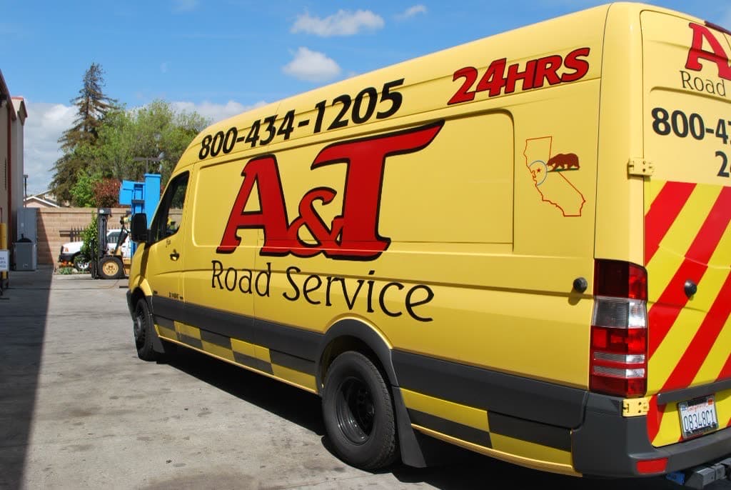 A&T yellow Sprinter rear branding ready for Clean Truck Check and compliance work