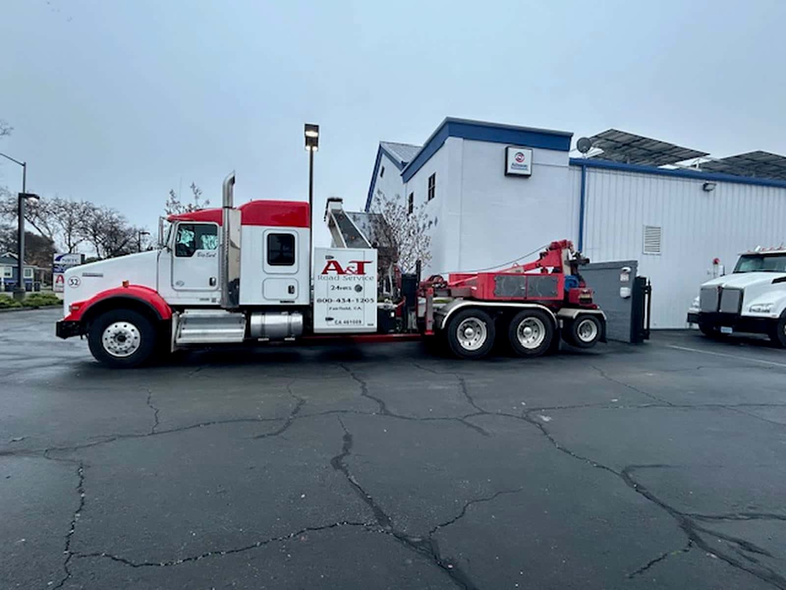 A&T Kenworth wrecker #32 Big Red side profile at the Fairfield lot