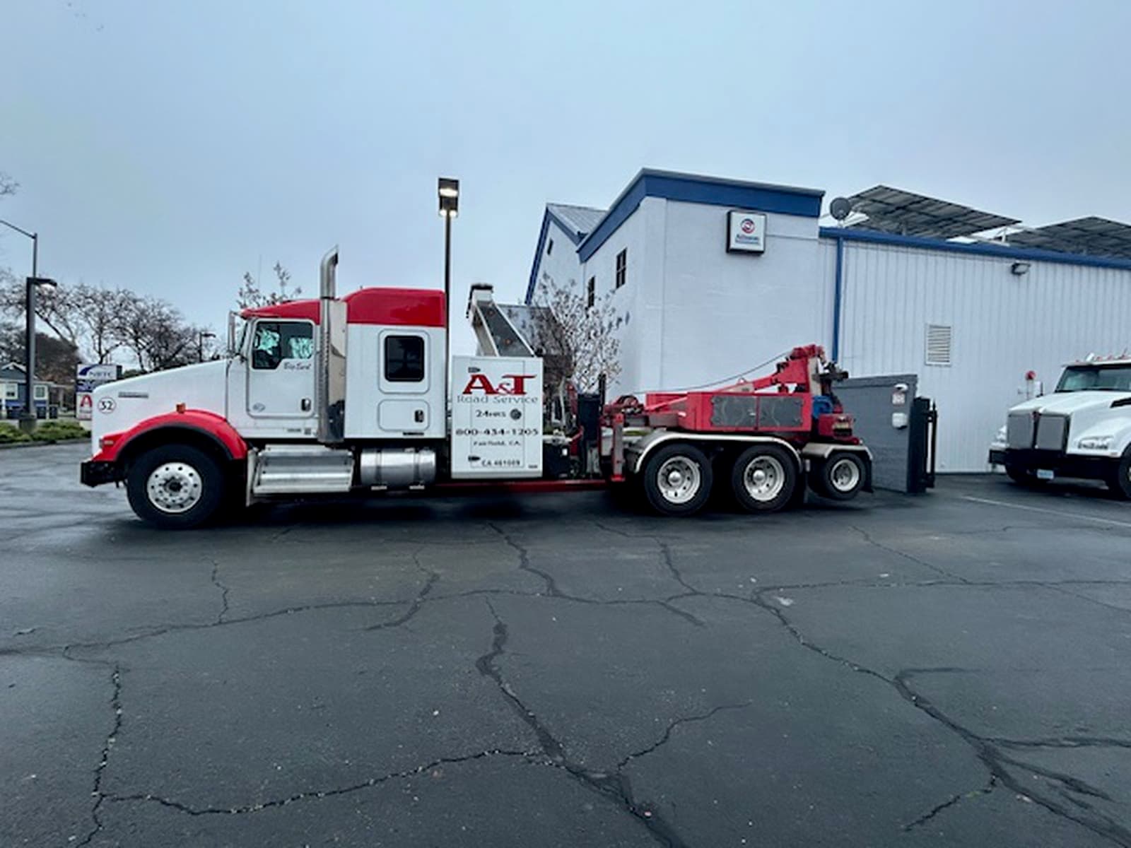 A&T Kenworth wrecker #32 Big Red side profile at the Fairfield lot